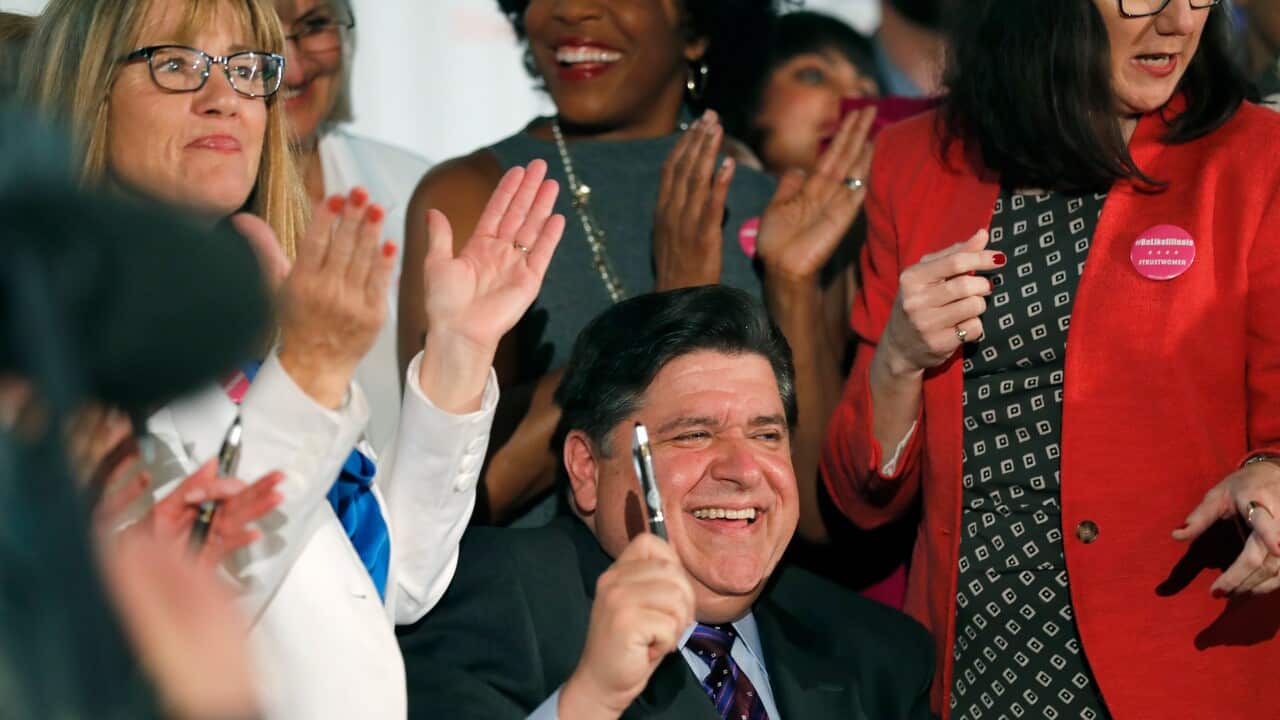 Illinois Governor J.B. Pritzker signs the Reproductive Health Act into law.