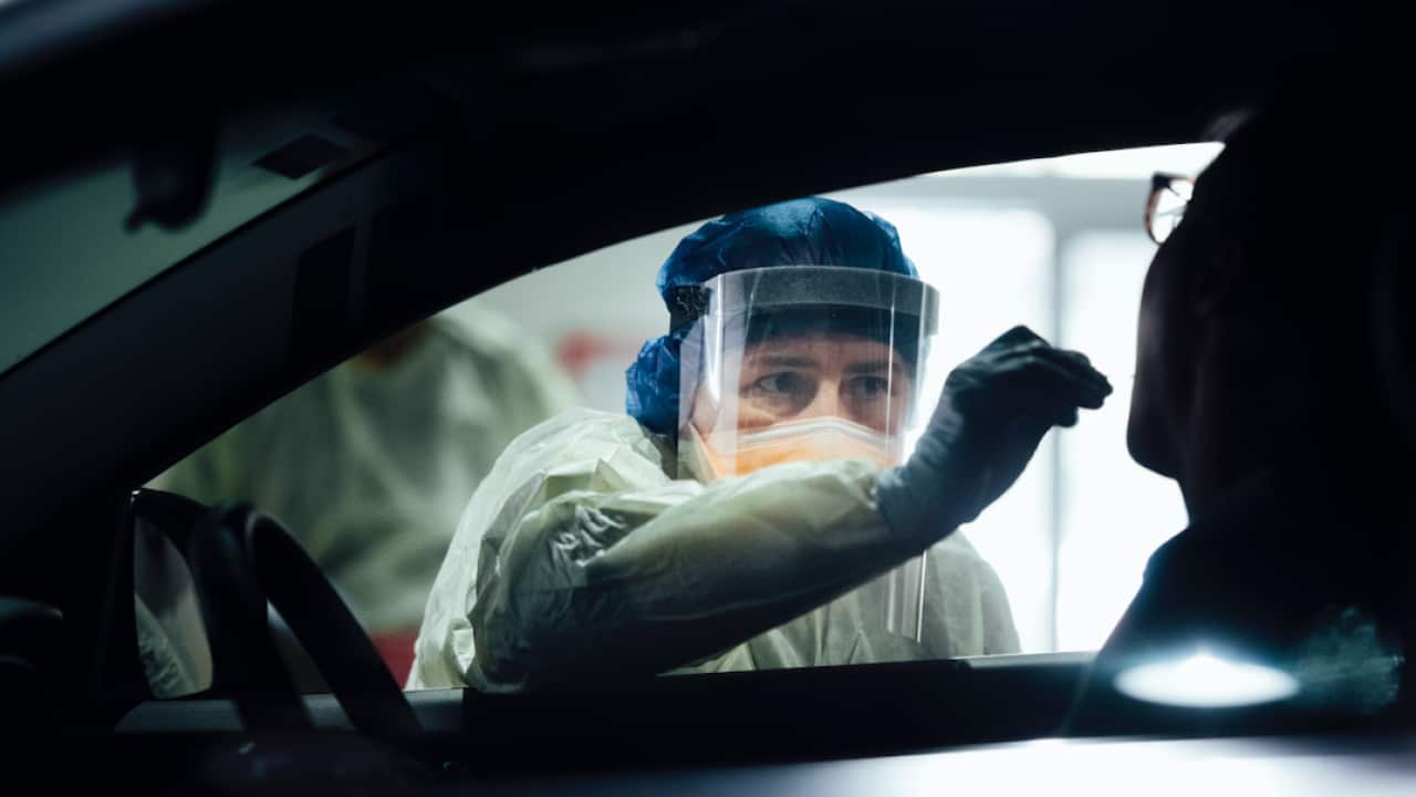 A nurse tests a patient at a COVID-19 testing site in ACT over the weekend.