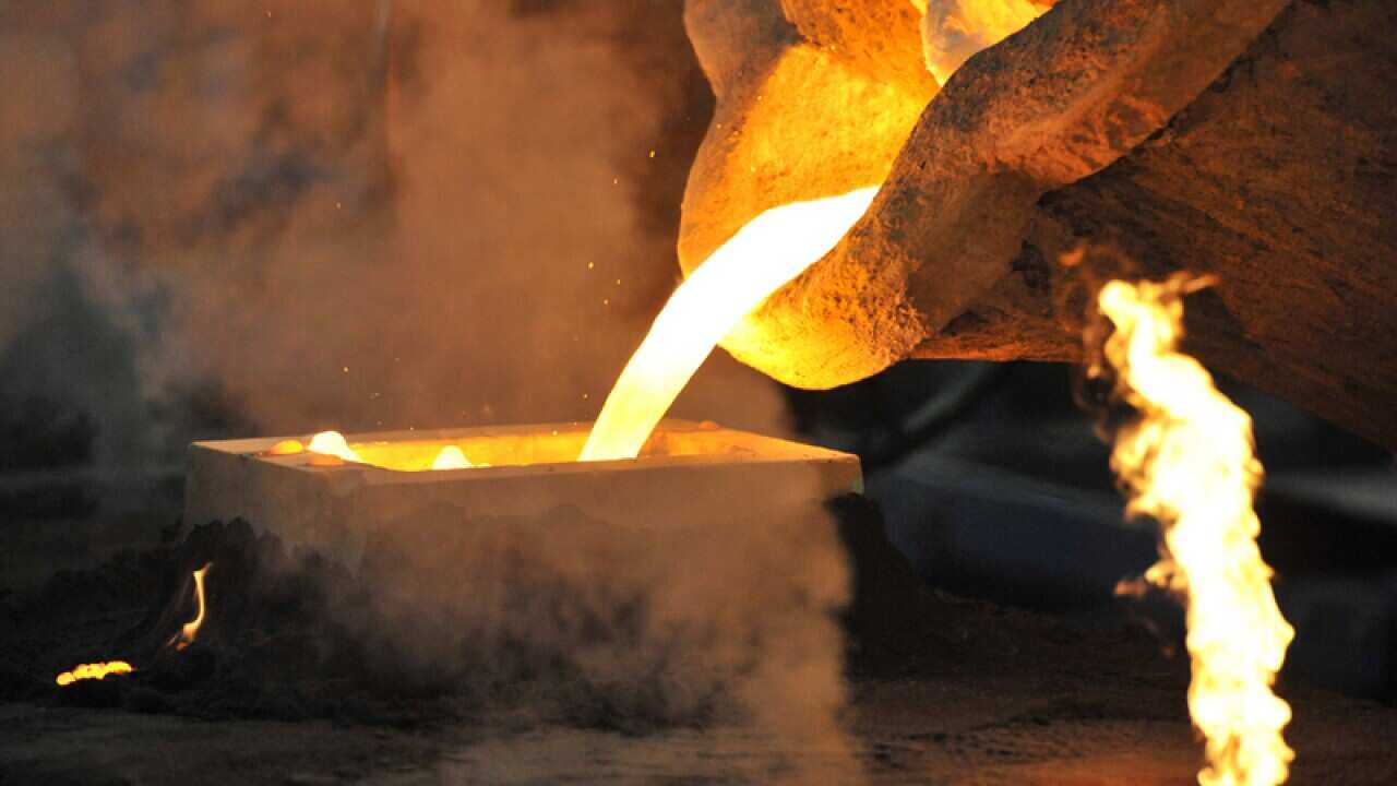 Molten metal is poured in a foundry