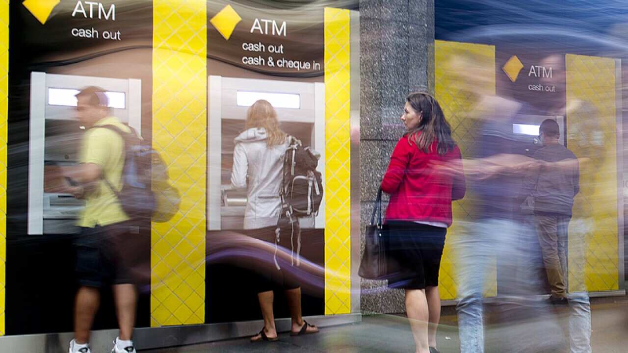 Customers using a Commonwealth Bank ATM