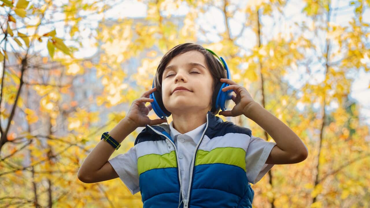 Boy listening to audio