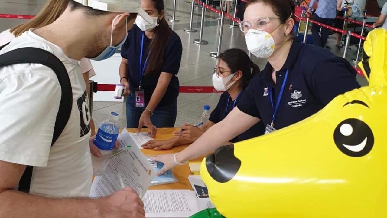 Australians stuck in Cambodia prepare to board a flight home on Monday morning.