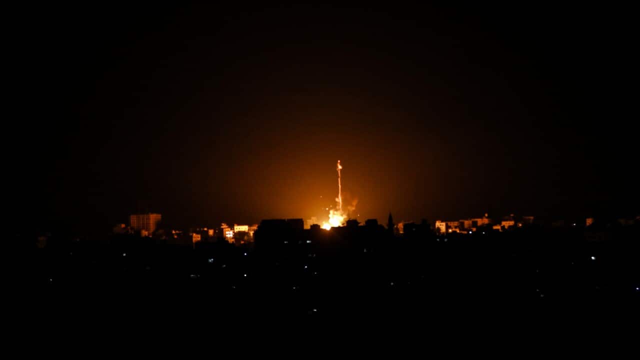 Smoke and flames rise in the distance after war planes belonging to the Israeli army carried out airstrikes over Jabalia, Gaza Strip