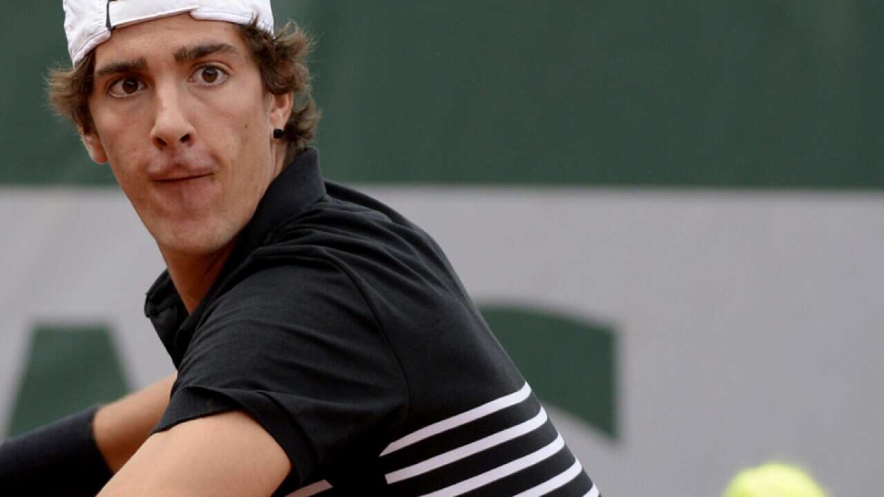 Thanasi Kokkinakis of Australia in action against Bernard Tomic