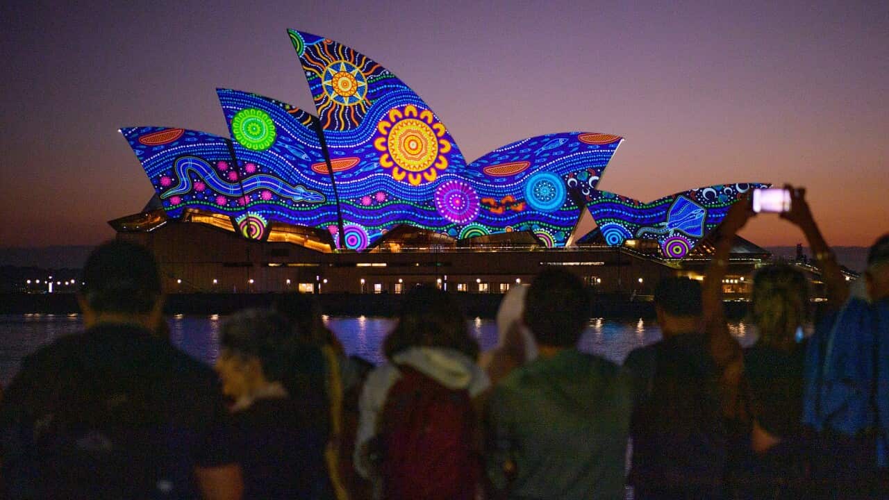 Kamilaroi artist Rhonda Sampson's 'Diyan Warrane' artwork is projected onto the sails of the Sydney Opera House at dawn on January 26 2023.