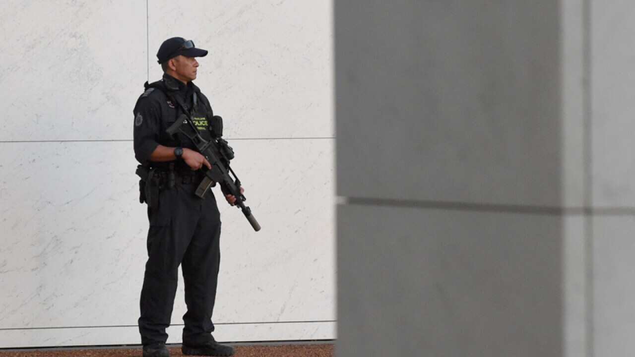An armed Australian Federal Police officer in Canberra