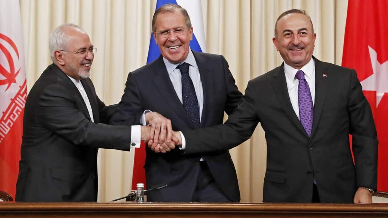 The Russian Foreign Minister Sergei Lavrov, centre, and his Iranian and Turkish counterparts hold talks to resolve the issue of Syria.