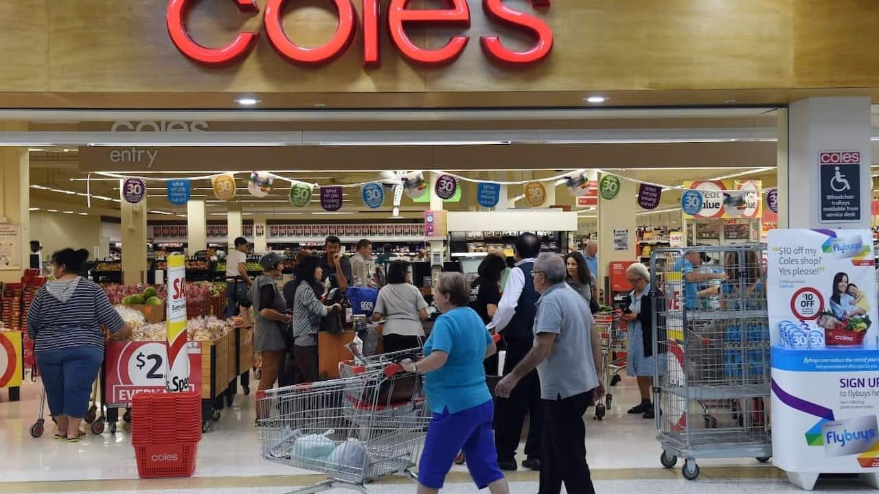 Shoppers queuing at the registers at a Coles supermarket in Sydney 