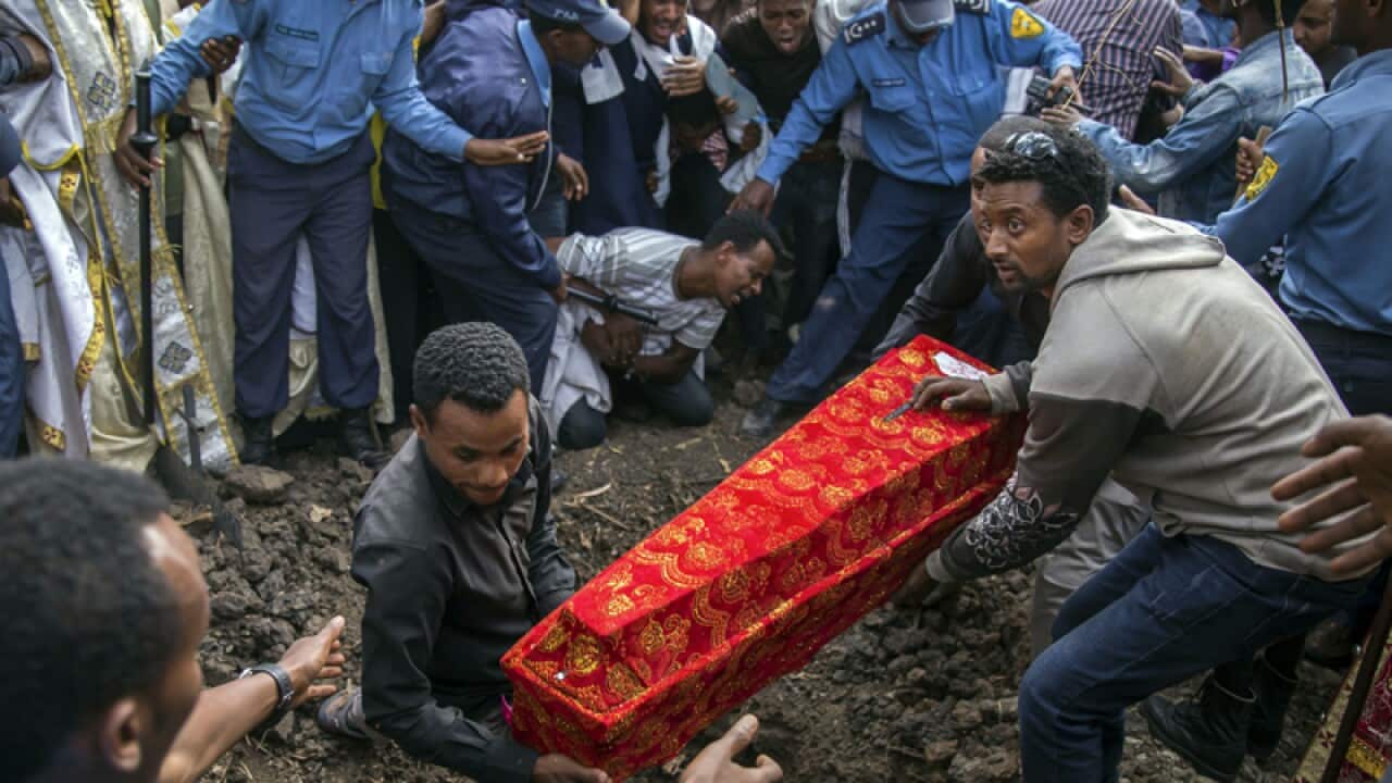 The coffin of one of those killed in the collapse