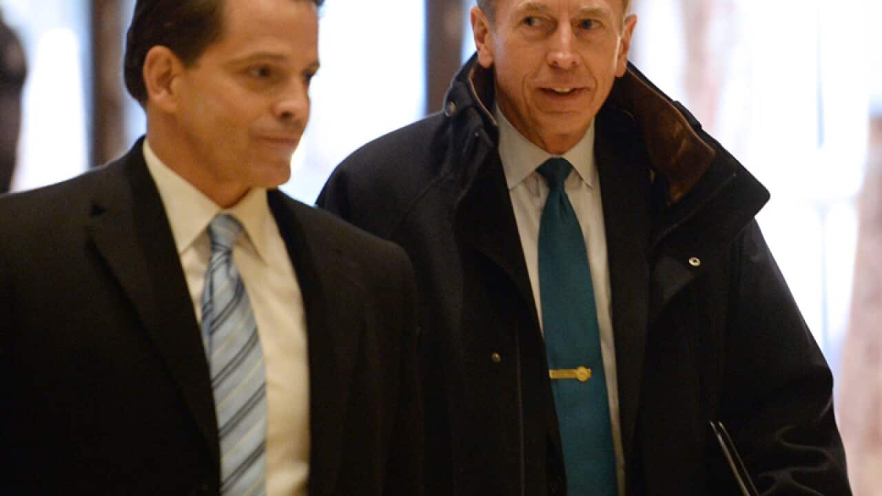 Former CIA boss David Petraeus (R)