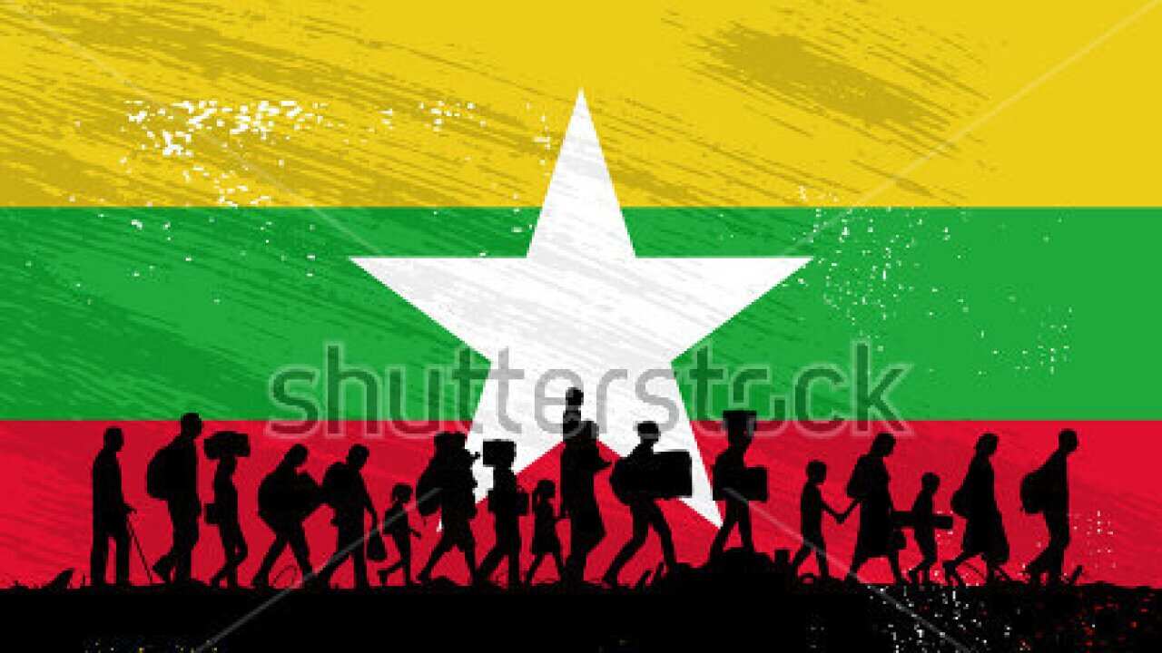 Silhouette of refugees people walking with flag of Myanmar as a background- (Vector-Pixabay)