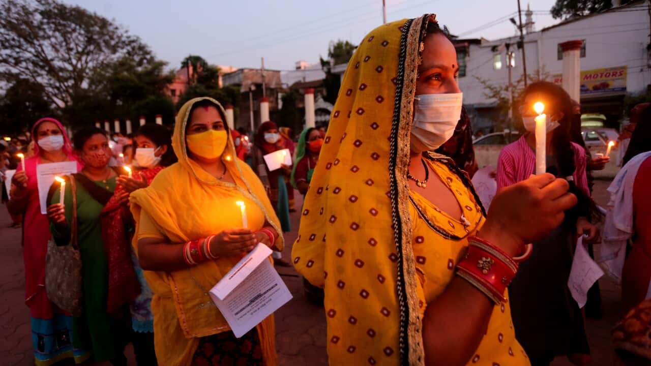 Indian activists protest against an alleged gang rape of a 19-year-old Dalit girl in Uttar Pradesh state, in Bhopal on 1 October. 