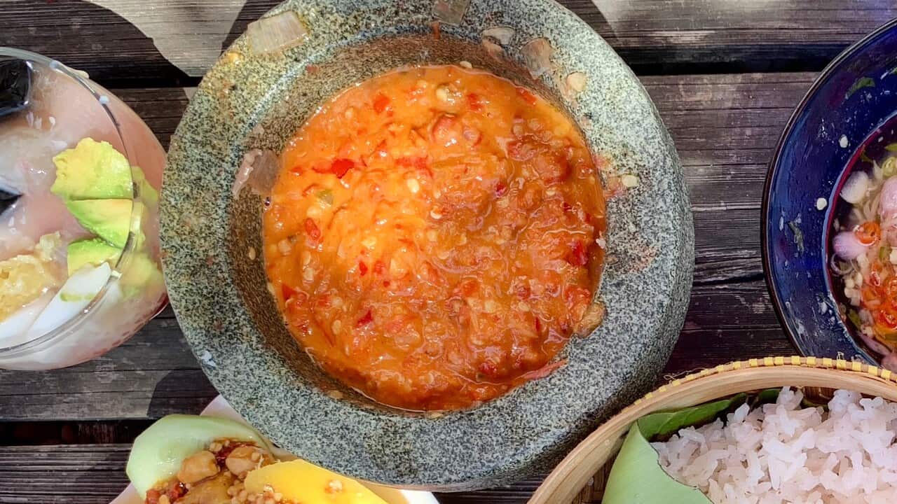 Famous Indonesian food, seafood & tempeh satay with nasi liwet and variety of sambal.