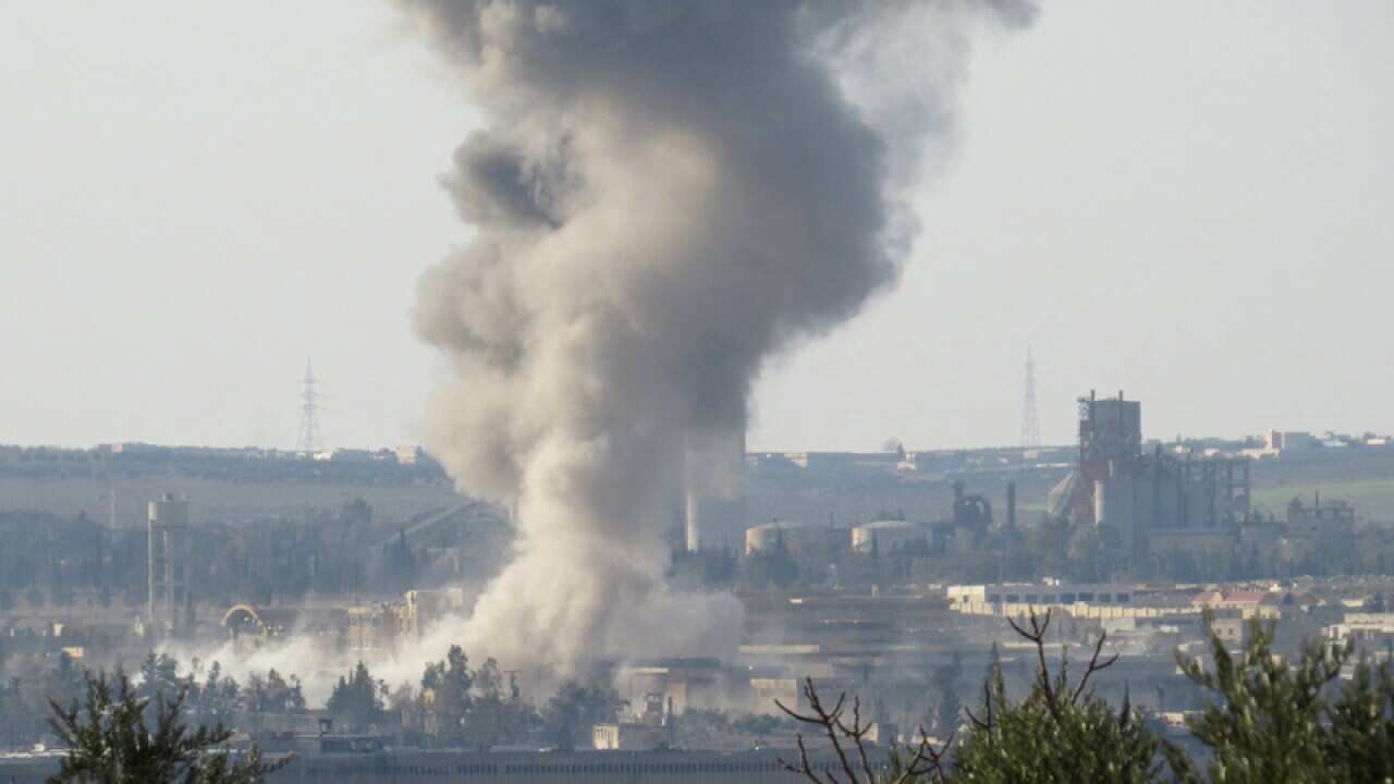 Smoke rises from Aleppo's central prison