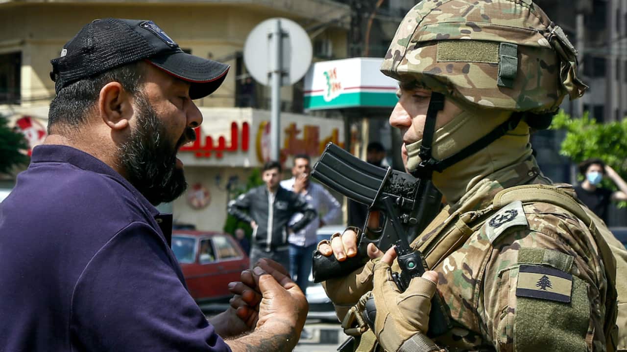 An anti-government protester argues with a Lebanese army officer in Tripoli this week.
