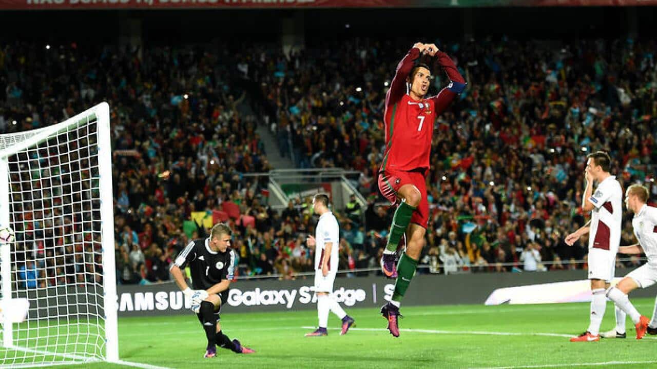 Cristiano Ronaldo celebrates scoring against Latvia