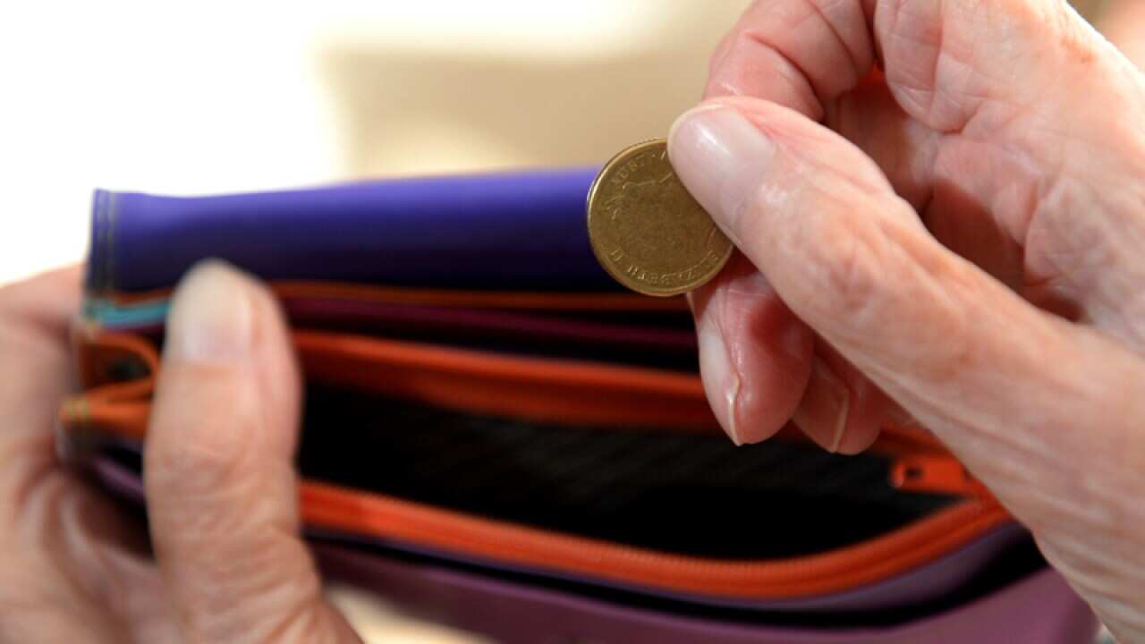 Money is taken out of a purse