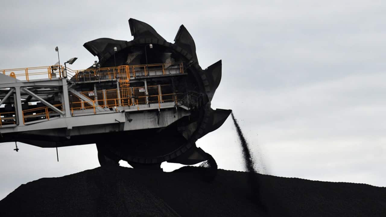 A coal loader shifts coal