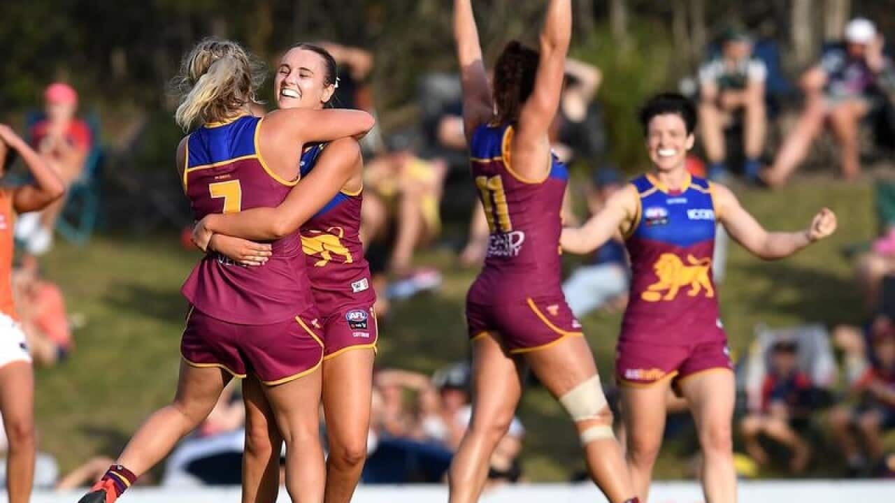 Lions players celebrate.