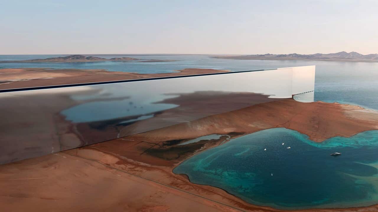 An artists impression of a mirrored mega-structure set in a Saudi Arabian landscape.