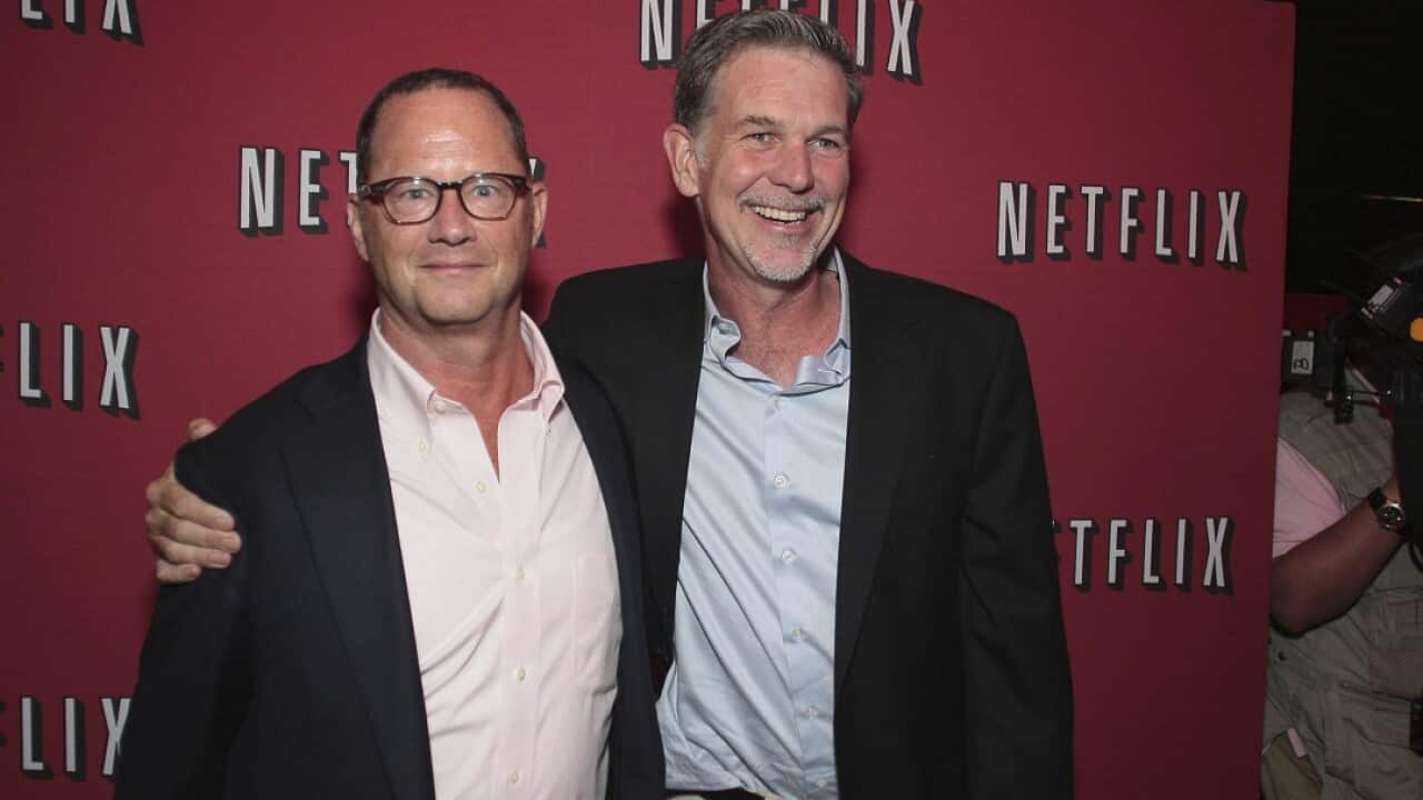 Jonathan Friedland, left, and the company’s chief executive Reed Hastings.