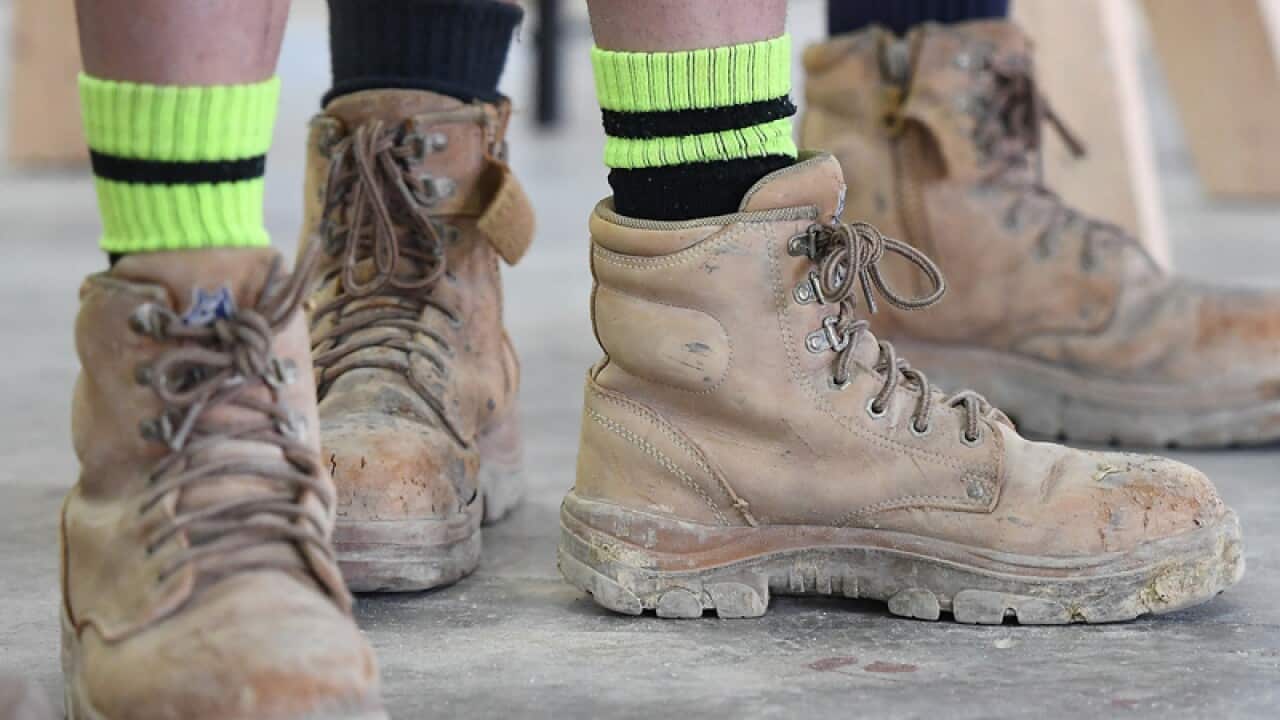 Apprentices wearing work boots