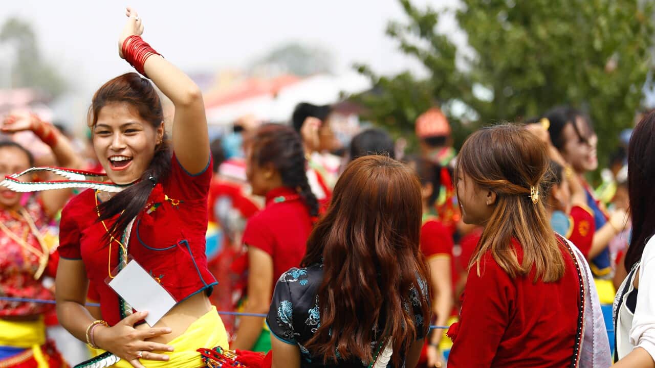 Nepali women dancing during Ubhauli celebration.