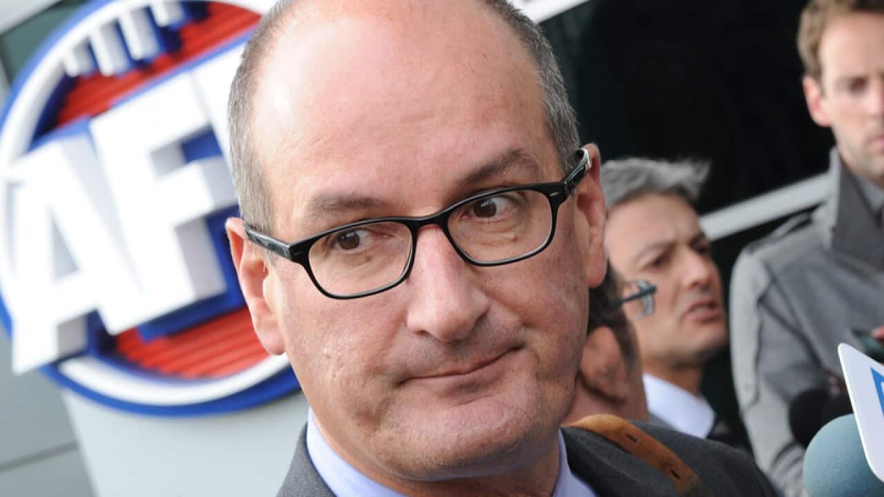 File photo of David Koch speaking to reporters