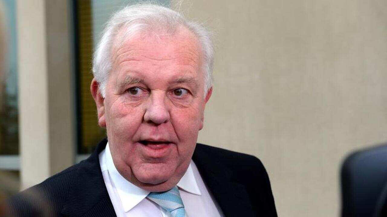 Senator-elect Joe Bullock (WA -Lab) arrives at Parliament House in Canberra, Thursday, July 3, 2014. New senators arrived today for familiarisation in parliamentary procedure. (AAP Image/Alan Porritt) NO ARCHIVING