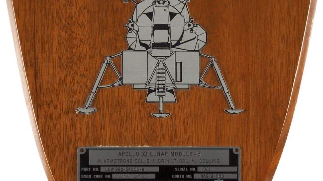 Apollo 11 ID plate sold at auction