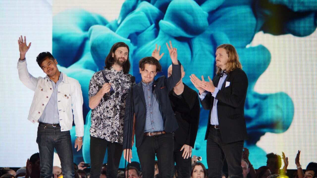 The Temper Trap accept the Best Group award.