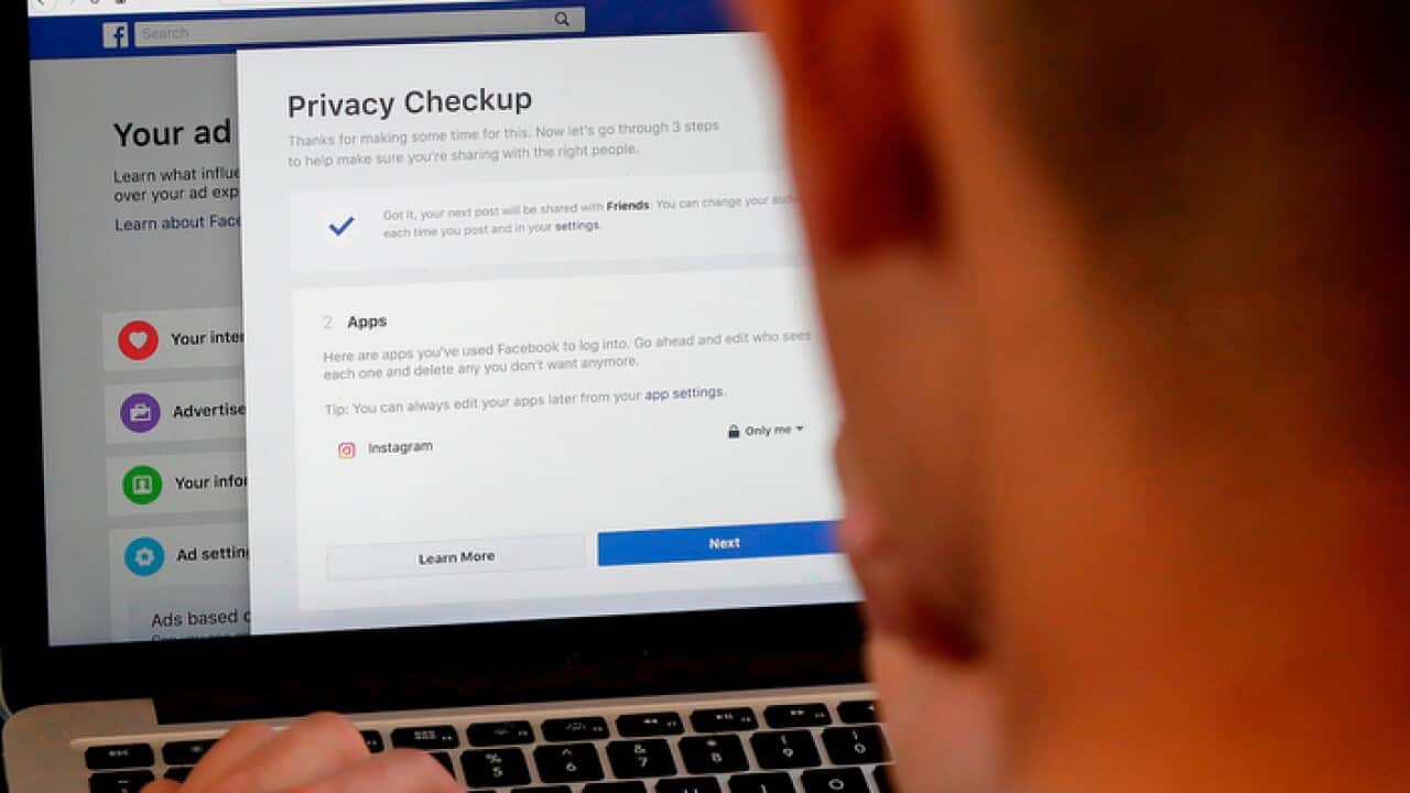 A Facebook user checks out his privacy settings on the popular app
