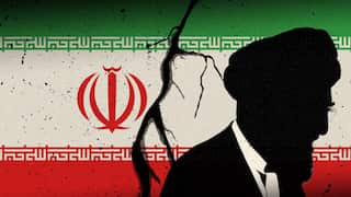 Silhouette of a man in front of a cracked Iranian flag, symbolising political turmoil.