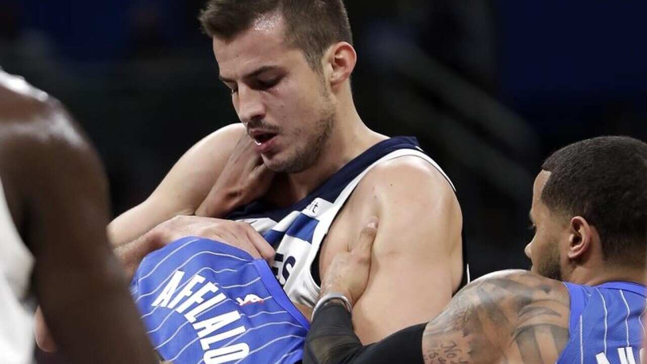 Orlando's Arron Afflalo (L) fights Minnesota's Nemanja Bjelica