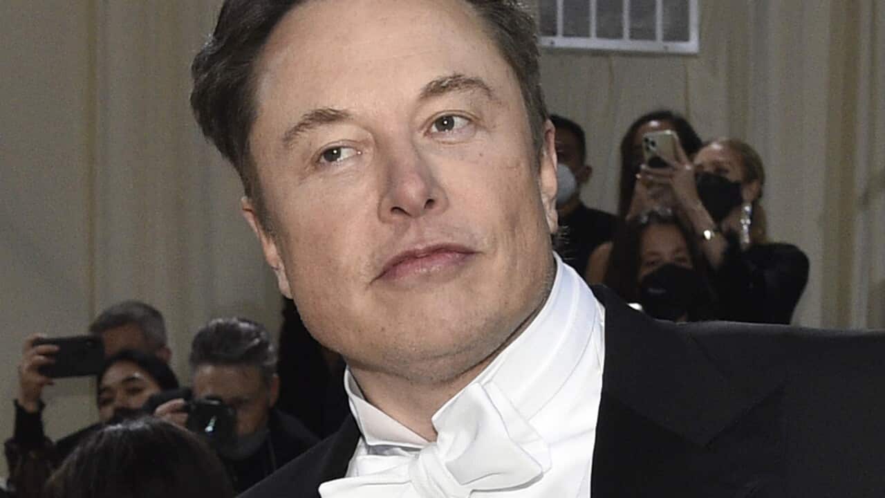 A man with a neutral facial expression.