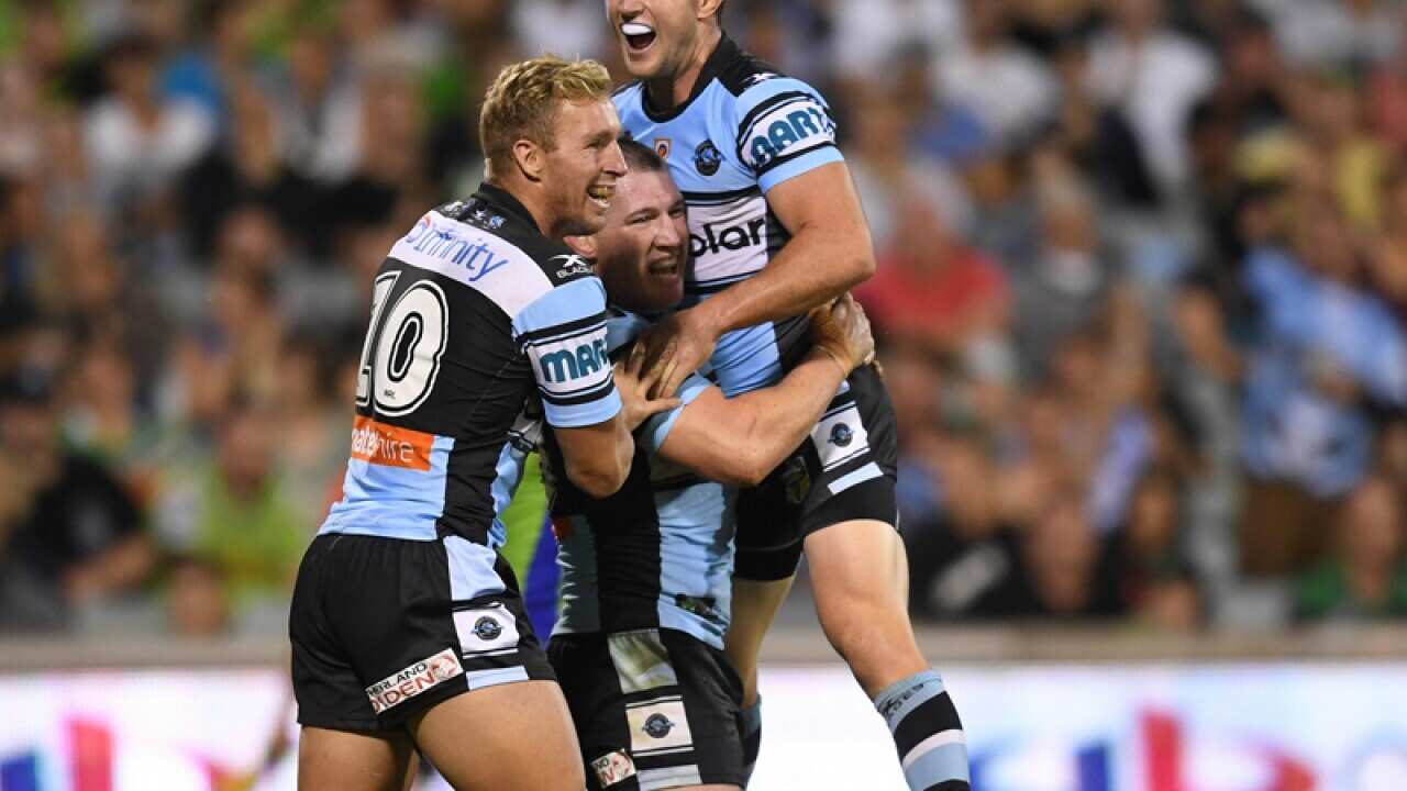 Paul Gallen of the Sharks (centre) celebrates