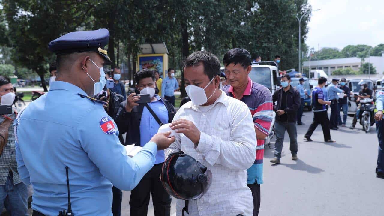 Cambodia government has distribute free face mask to people along the street