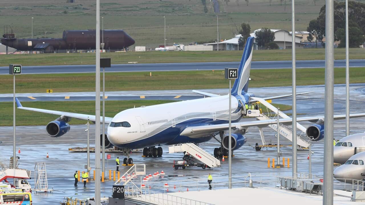 A plane from Uruguay carrying Australian passengers from aboard the Greg Mortimer lands at Melbourne Airport.
