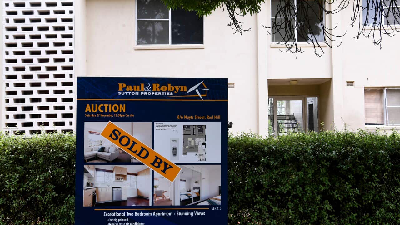 A ’SOLD’ sign is seen outside an apartment block in Canberra.