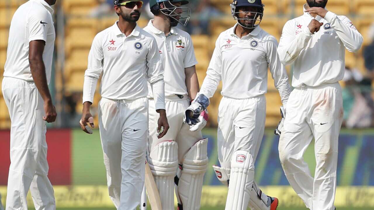 Virat Kohli (R) gestures to ask for a umpire decision review