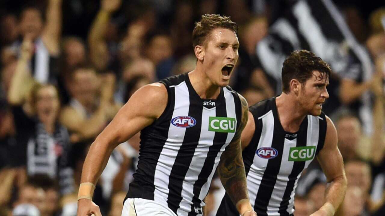 Collingwood's Jesse White celebrates after scoring a goal