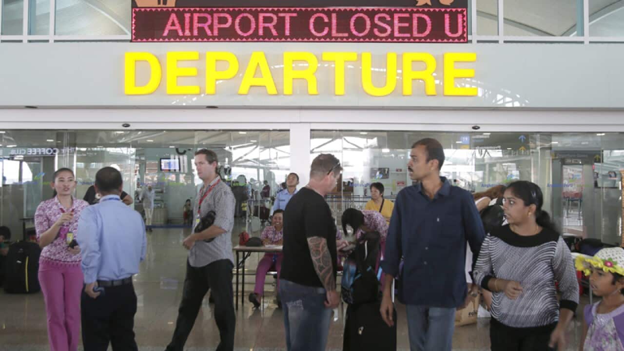 Passangers wait for their delayed flights at Bali's Airport