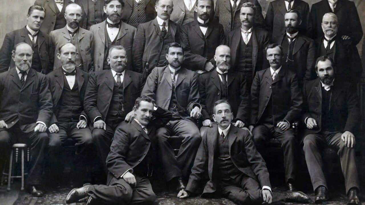 Group photograph of Federal Labour Party MPs elected to the Australian House of Representatives and Australian Senate at the inaugural 1901 election, including Chris Watson, Andrew Fisher, Billy Hughes, Frank Tudor, King O'Malley and Lee Batchelor. Billy Hughes is at the bottom right. 
