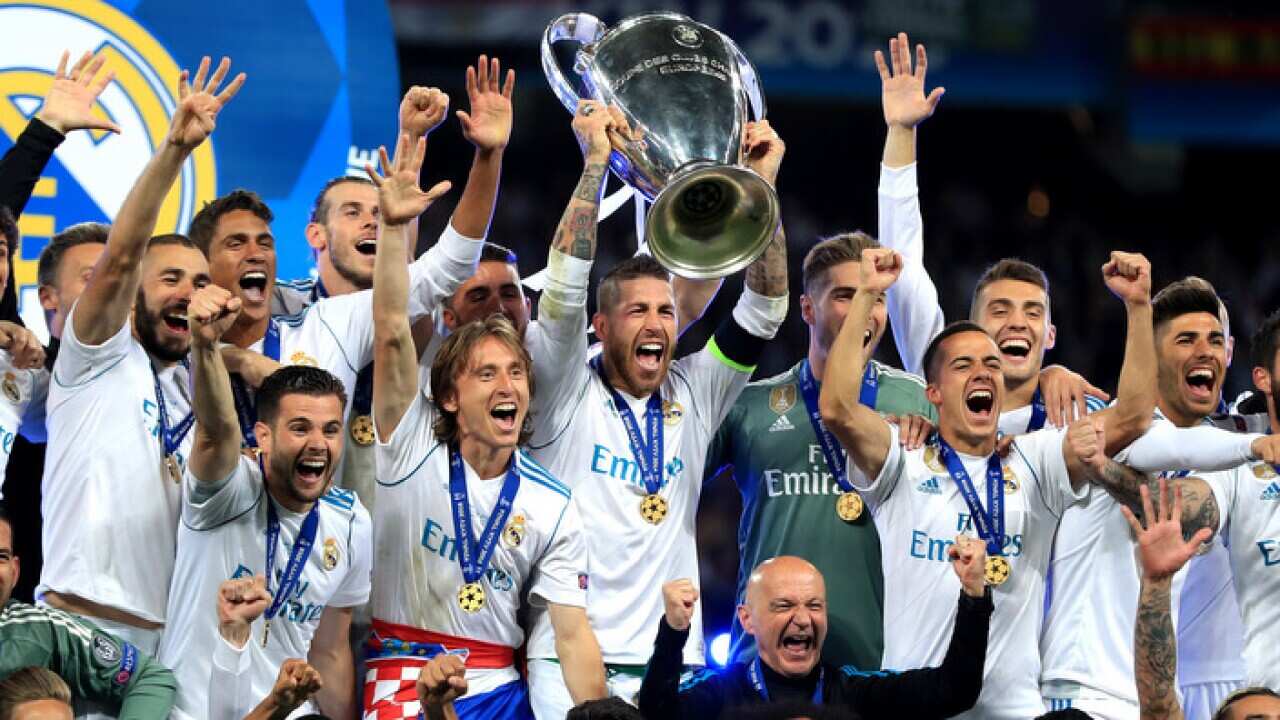 Real Madrid celebrates with the Champions League trophy