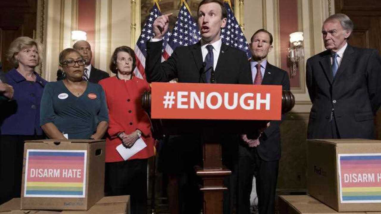 Senator Chris Murphy (center) calls for gun control legislation in the wake of the mass shooting in an Orlando LGBT nightclub.