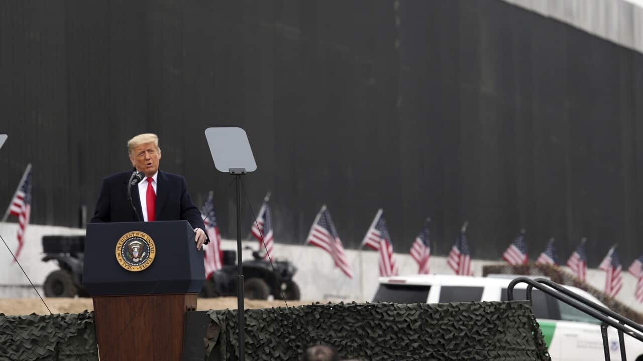 President Donald Trump speaks near a section of the U.S.-Mexico border wall, Tuesday, Jan. 12, 2021, in Alamo, Texas.