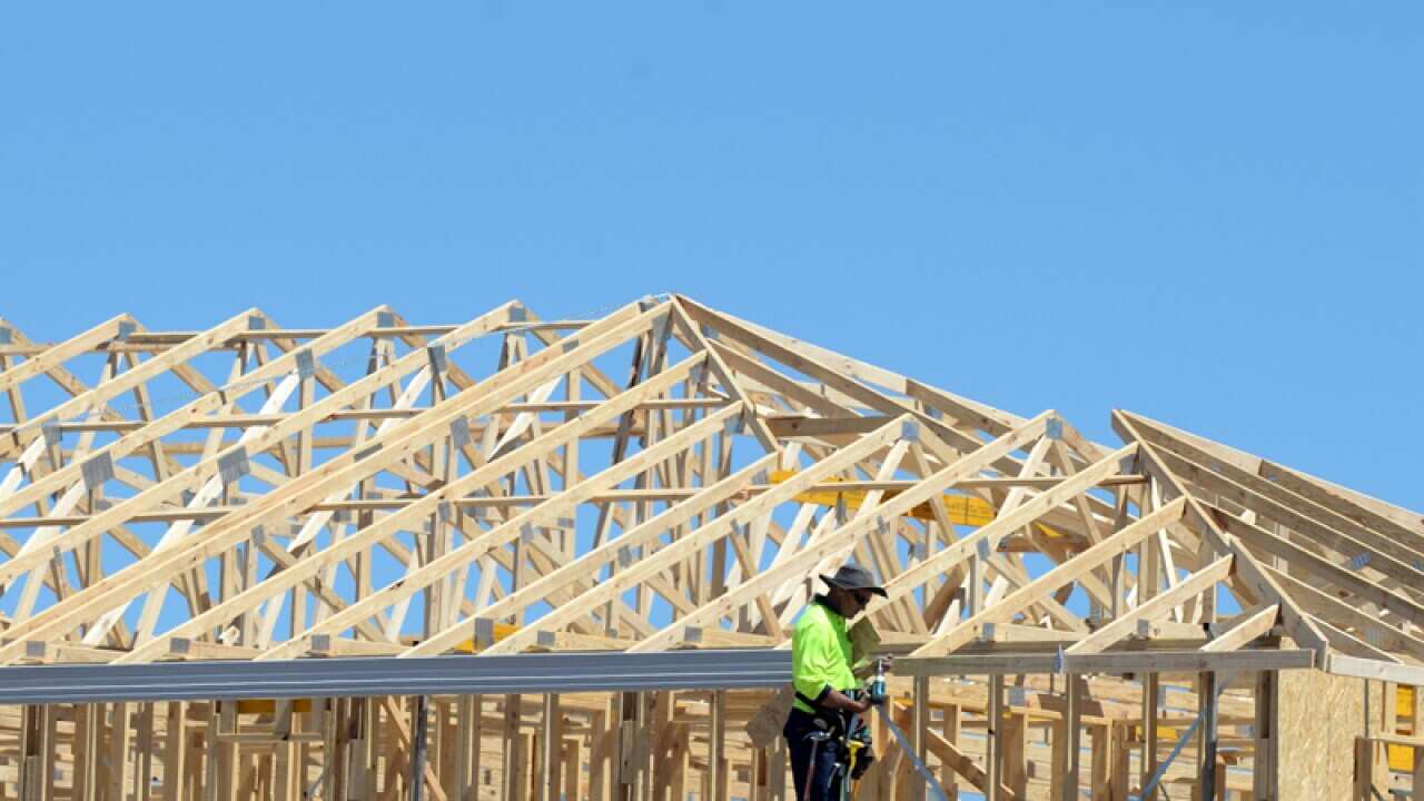 A file photo of a carpenter working on a home