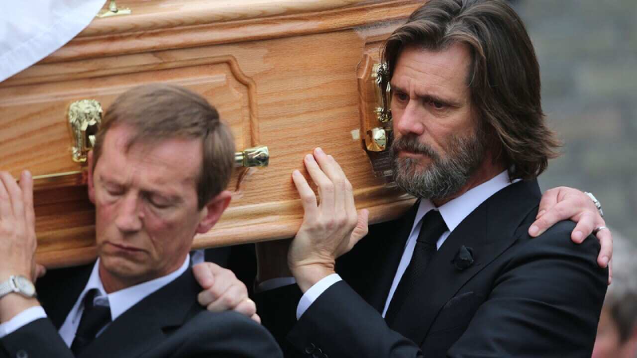 Jim Carrey carries the coffin of his ex-girlfriend Cathriona White