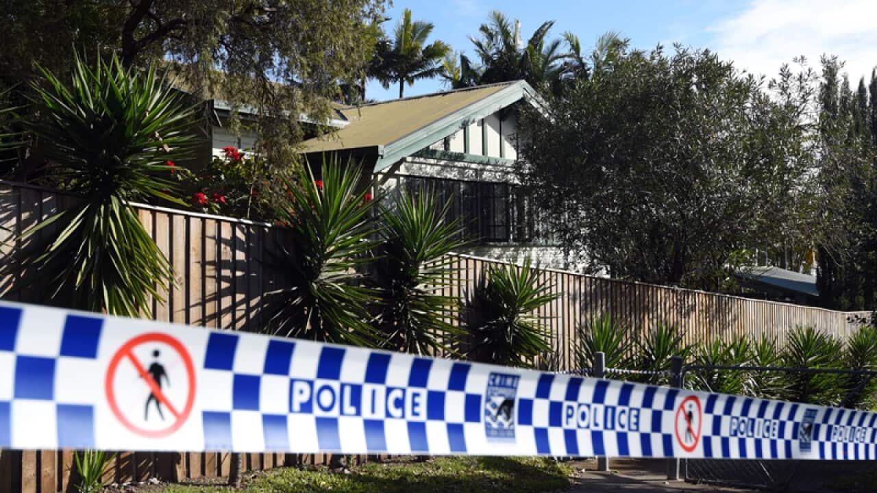 Police tape cordons off a house in Brisbane's south