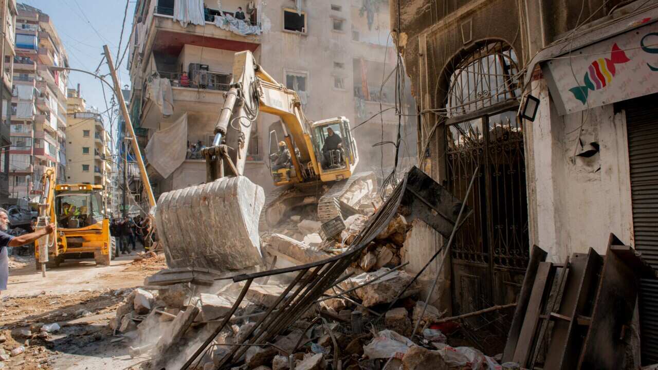 A bulldozer removes debris at the site of an Israeli air strike, amid ongoing hostilities between Hezbollah and Israeli forces, in Beirut, Lebanon, October 11, 2024